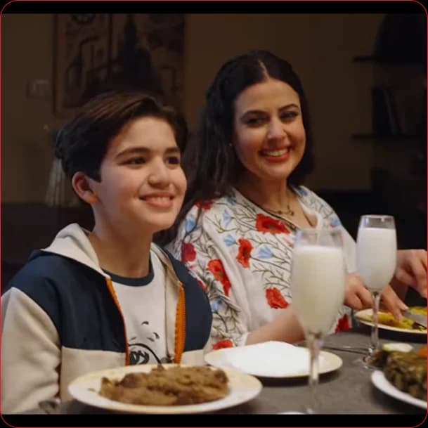 Corporate media production team discussing strategy in modern studio